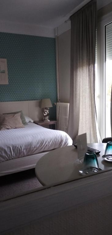 Postel nebo postele na pokoji v ubytování Hotel Le Rivage