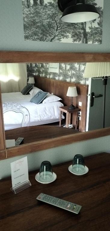 Postel nebo postele na pokoji v ubytování Hotel Le Rivage