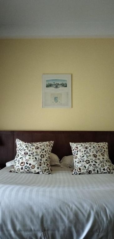 Postel nebo postele na pokoji v ubytování Hotel Le Rivage