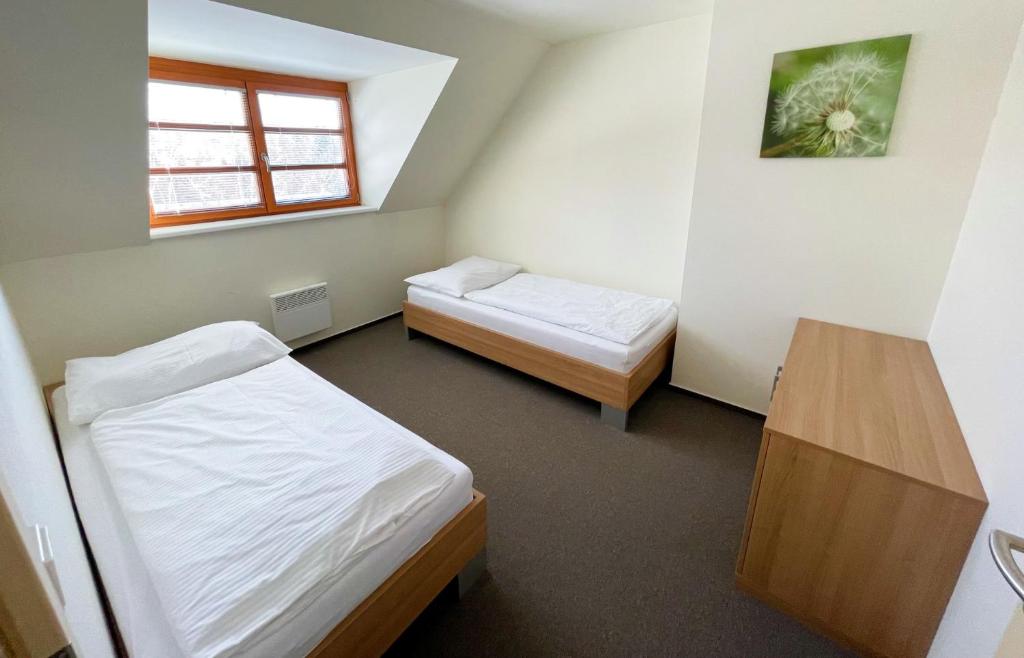 Postel nebo postele na pokoji v ubytování Wellness Hotel Říčky