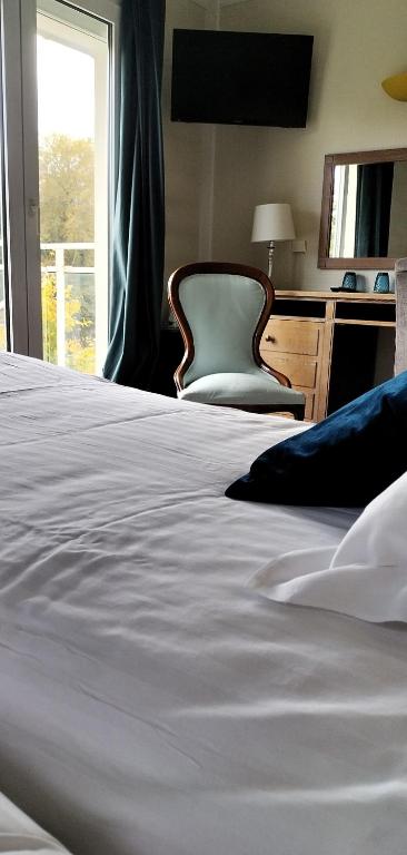 Postel nebo postele na pokoji v ubytování Hotel Le Rivage