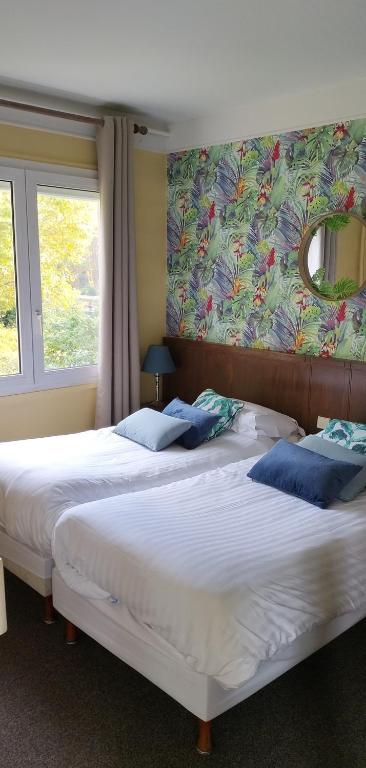 Postel nebo postele na pokoji v ubytování Hotel Le Rivage