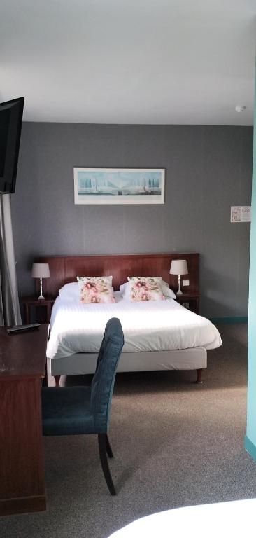 Postel nebo postele na pokoji v ubytování Hotel Le Rivage