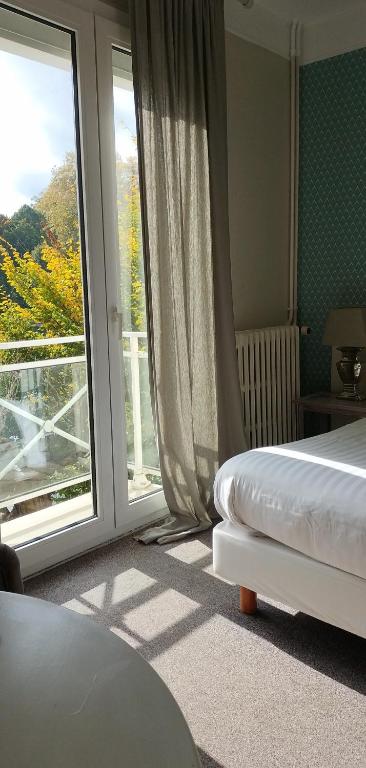 Postel nebo postele na pokoji v ubytování Hotel Le Rivage