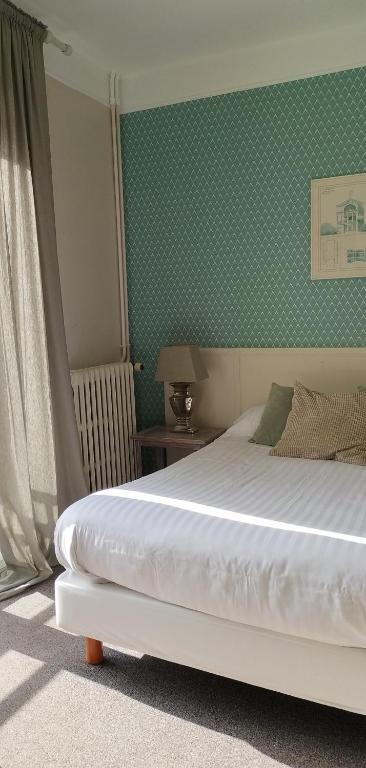 Postel nebo postele na pokoji v ubytování Hotel Le Rivage