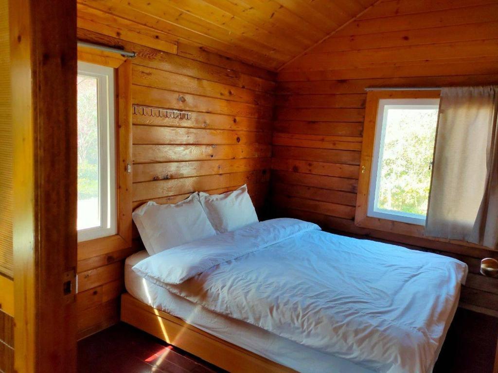 Postel nebo postele na pokoji v ubytování Peach Holiday Manoranor