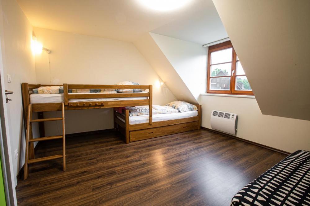 Postel nebo postele na pokoji v ubytování Wellness Hotel Říčky