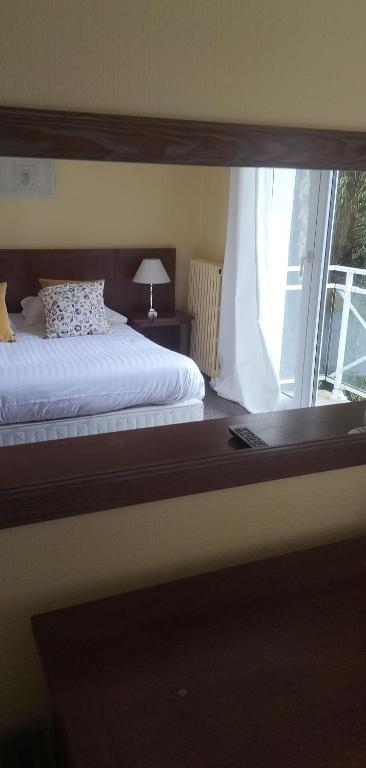 Postel nebo postele na pokoji v ubytování Hotel Le Rivage
