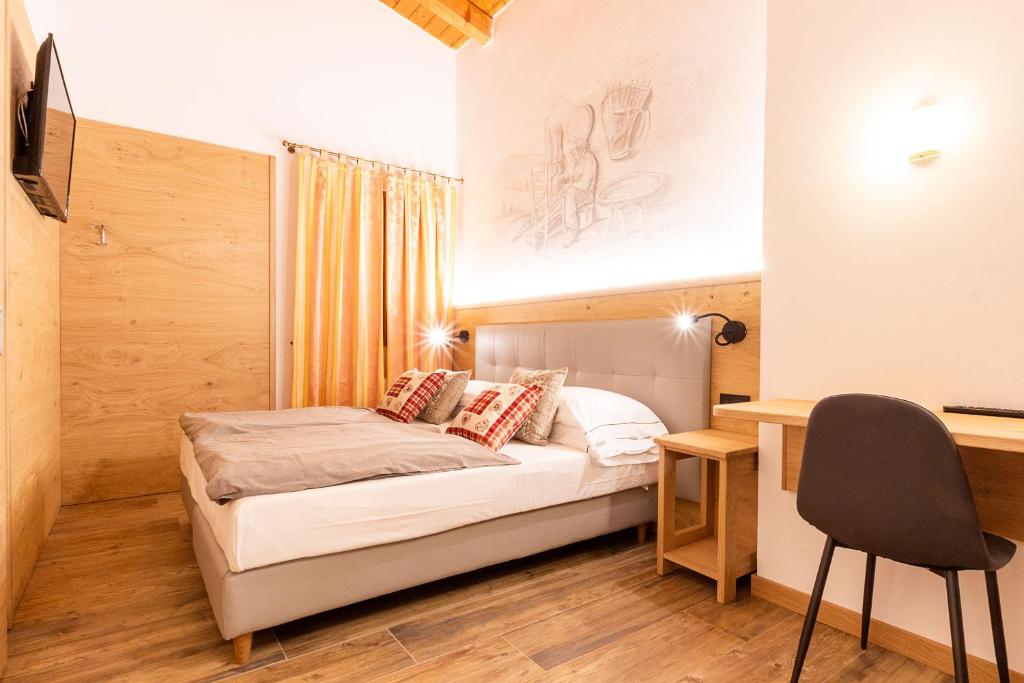 Posteľ alebo postele v izbe v ubytovaní Residence Hotel Santa Maria piscina e wellness