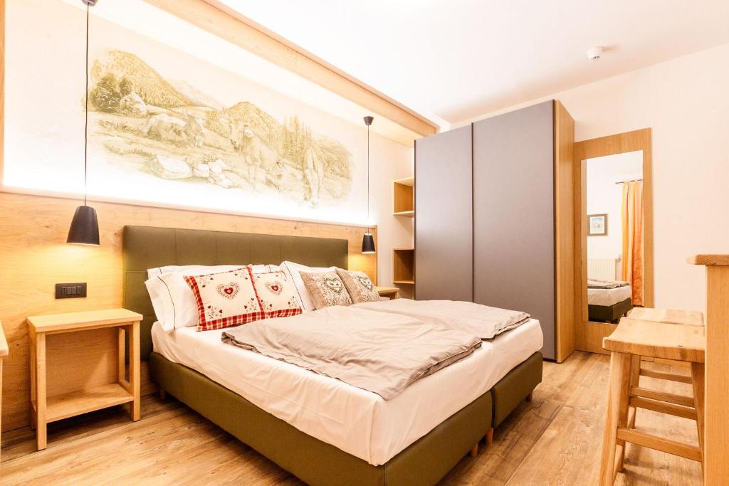 Posteľ alebo postele v izbe v ubytovaní Residence Hotel Santa Maria piscina e wellness