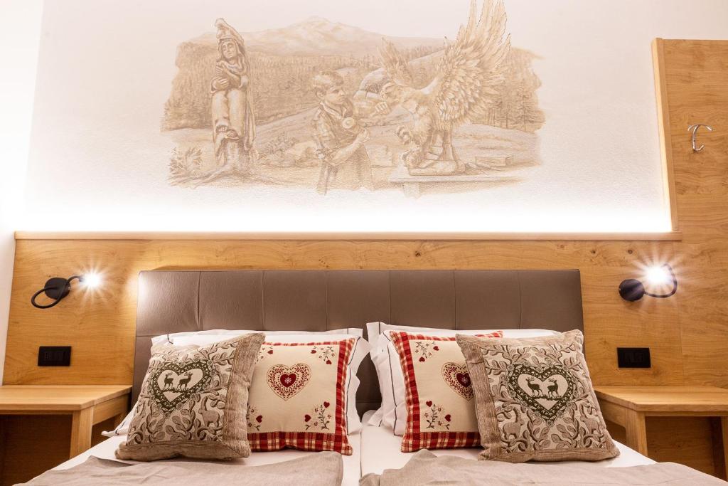 Posteľ alebo postele v izbe v ubytovaní Residence Hotel Santa Maria piscina e wellness