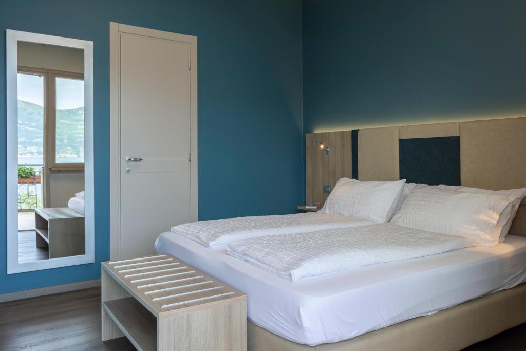 Postel nebo postele na pokoji v ubytování Hotel Veronesi