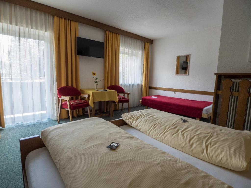 Postel nebo postele na pokoji v ubytování Traditionsgasthof Weißbacher