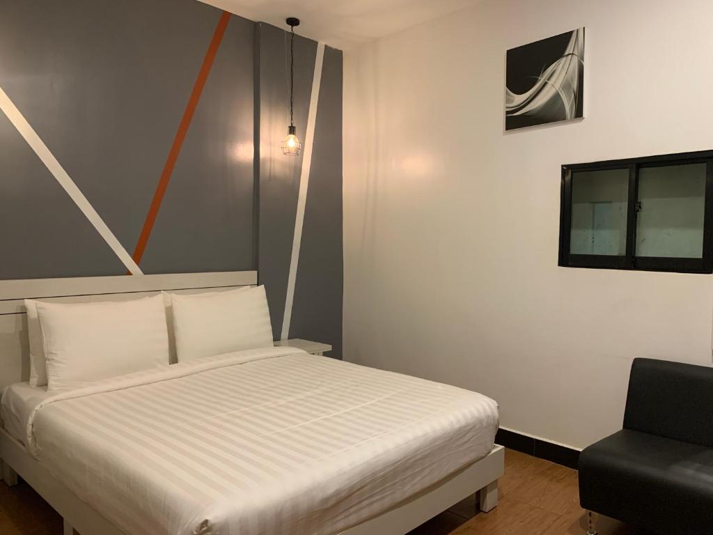 Postel nebo postele na pokoji v ubytování DE Hotel
