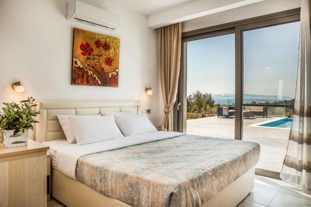 Posteľ alebo postele v izbe v ubytovaní Villa Theofilos