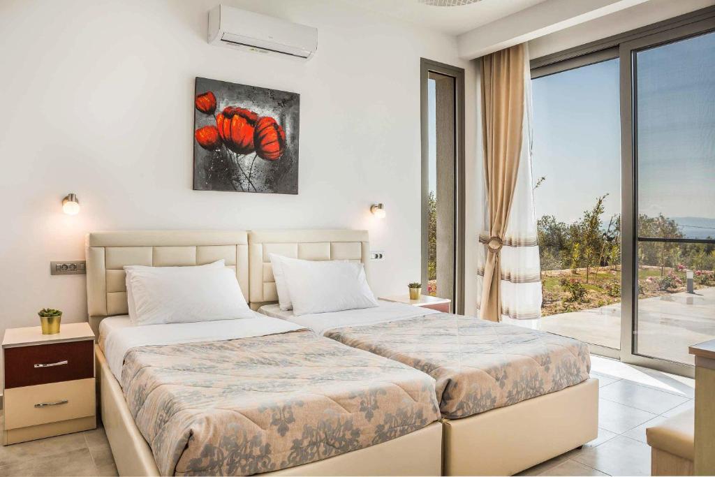 Posteľ alebo postele v izbe v ubytovaní Villa Theofilos
