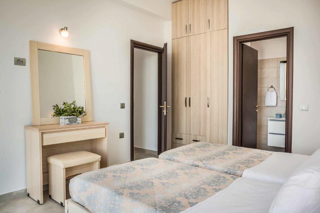 Posteľ alebo postele v izbe v ubytovaní Villa Theofilos