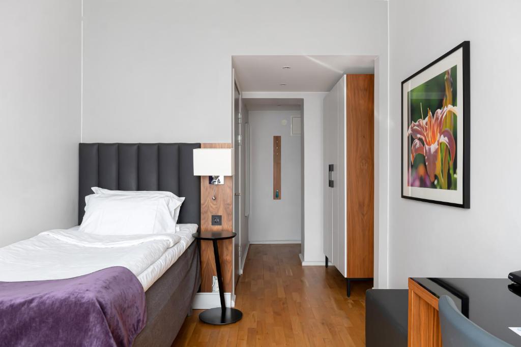 Postel nebo postele na pokoji v ubytování Elite Stadshotellet Eskilstuna