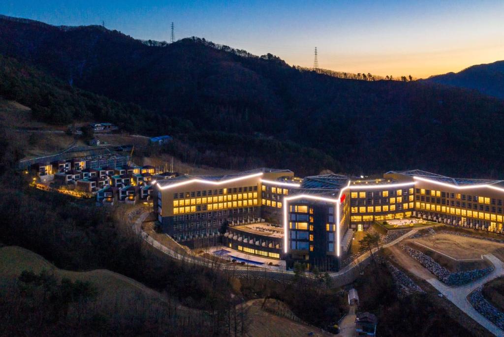 an overhead view of a building with lights on at Pyeongchang Ramada Hotel & Suite by Wyndham in Pyeongchang 