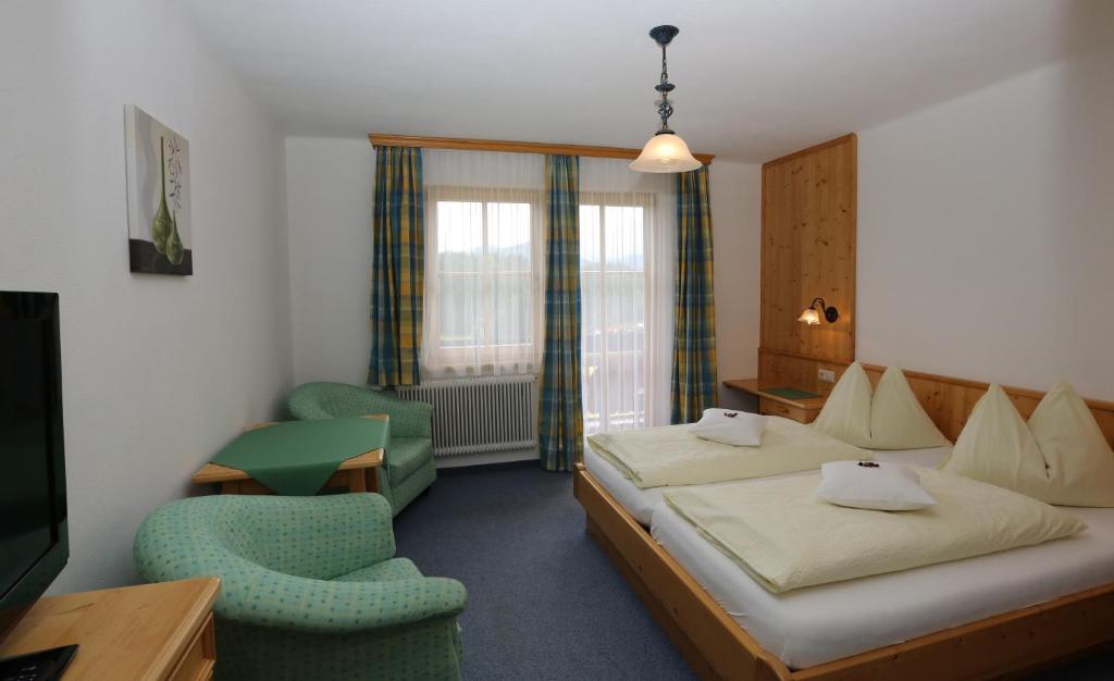 Een bed of bedden in een kamer bij Alpenperle