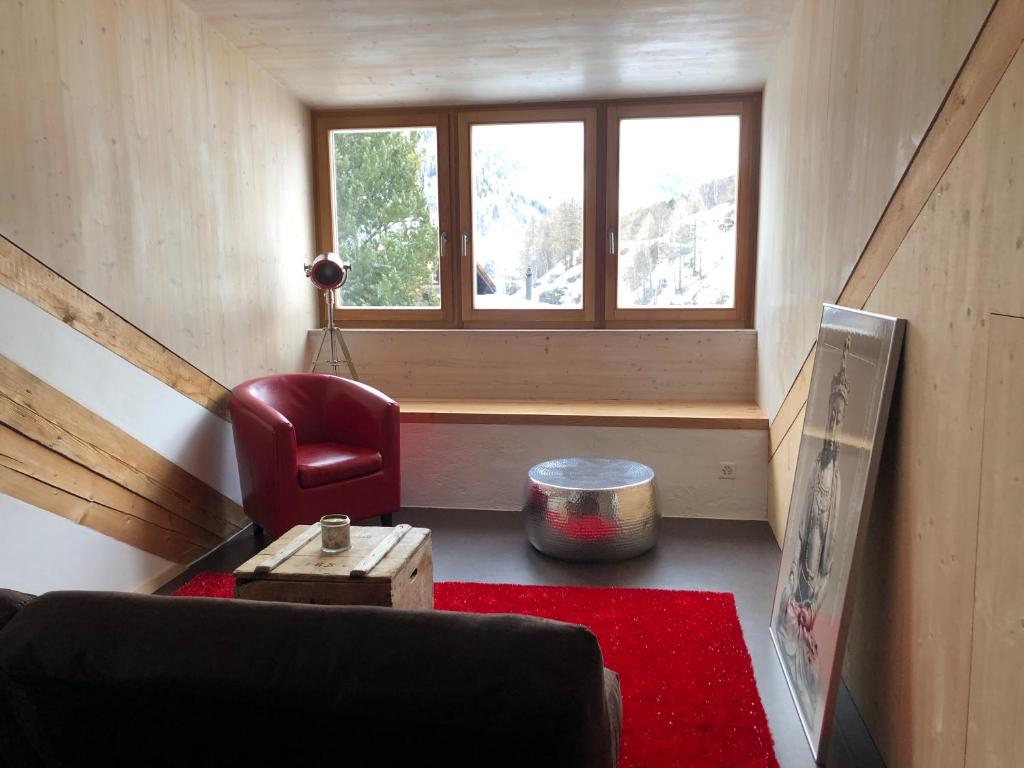 Area soggiorno di Loft 100m2, im Ökohaus in Susch