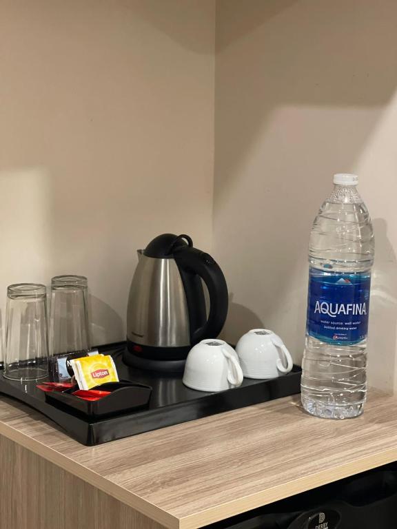 Příslušenství pro přípravu čaje a kávy v ubytování Grand Tourist Hotel