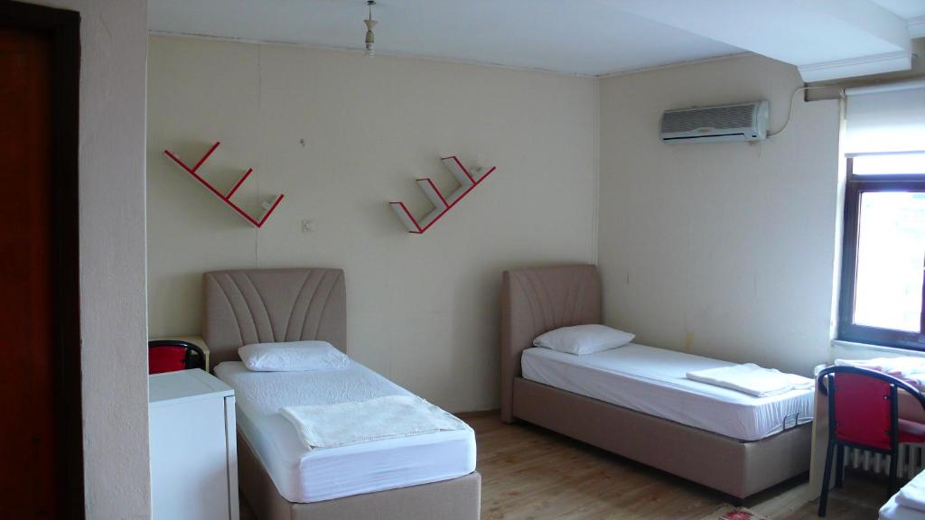 A bed or beds in a room at Trabzon Star Pension