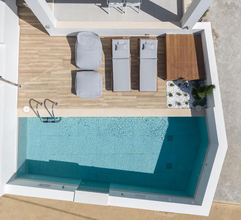 a rendering of a swimming pool in a house at De Light Boutique Villas I II & III - Fine retreat, by ThinkVilla in Atsipopoulo