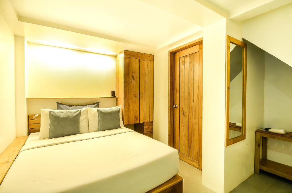 Postel nebo postele na pokoji v ubytování Zuzuni Boutique Hotel