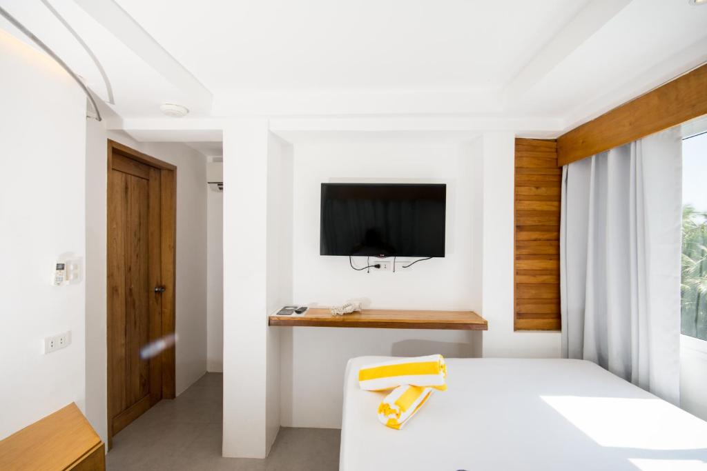 TV a/nebo společenská místnost v ubytování Zuzuni Boutique Hotel