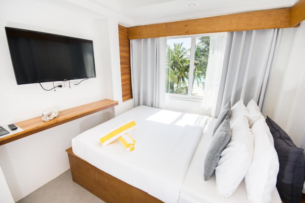 Postel nebo postele na pokoji v ubytování Zuzuni Boutique Hotel