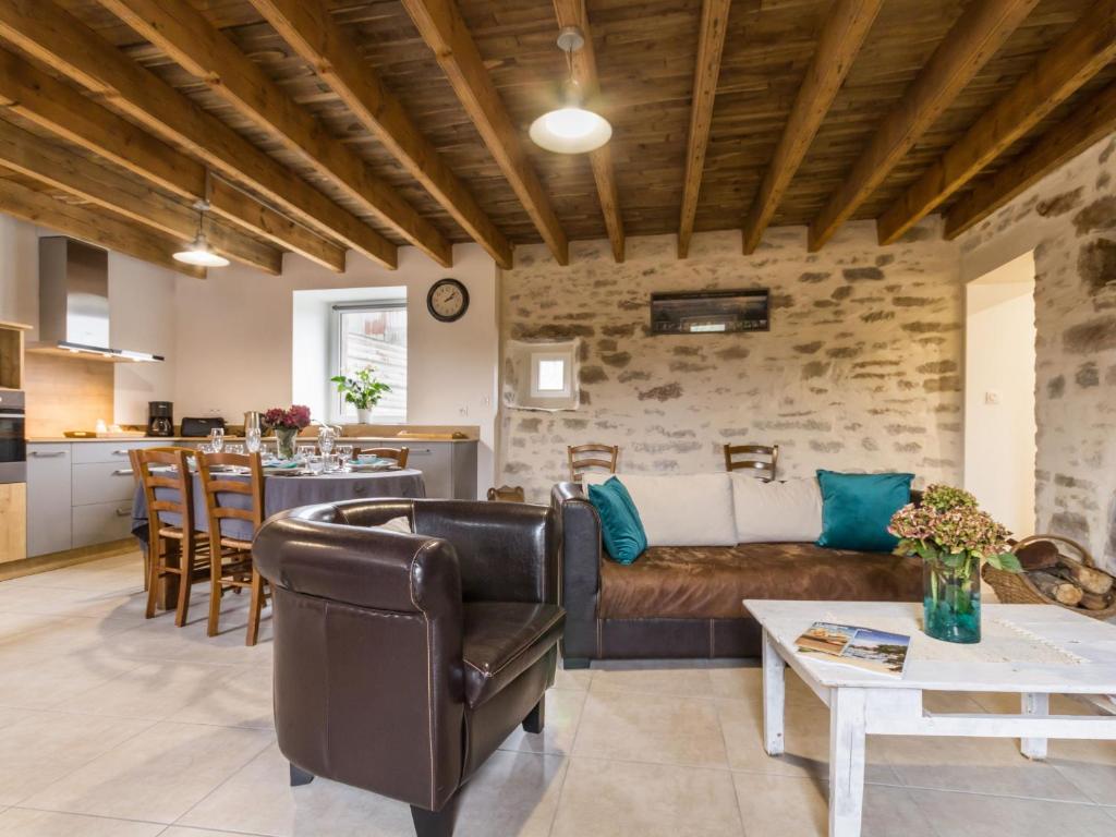 a living room with a couch and a table at Gîte Guérande, 3 pièces, 5 personnes - FR-1-306-1197 in Guérande