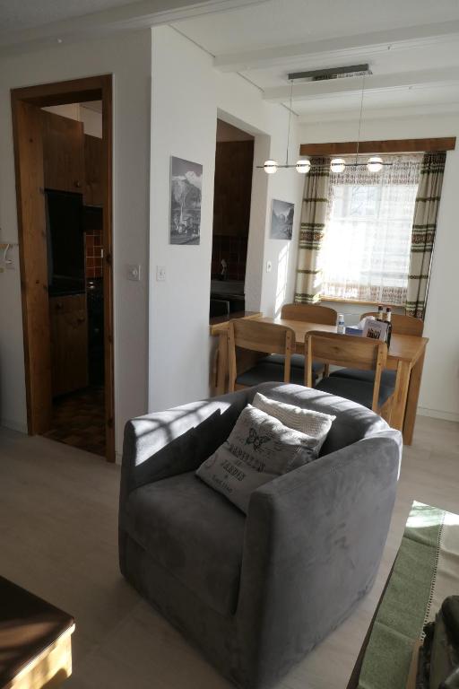 a living room with a couch and a table at Chalet Valeria in Saas-Fee
