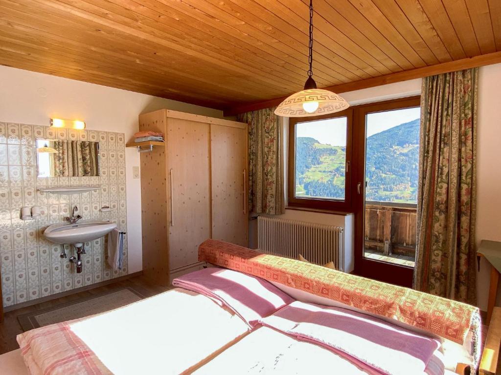 A bed or beds in a room at Apartment Baumannerhof-1 by Interhome