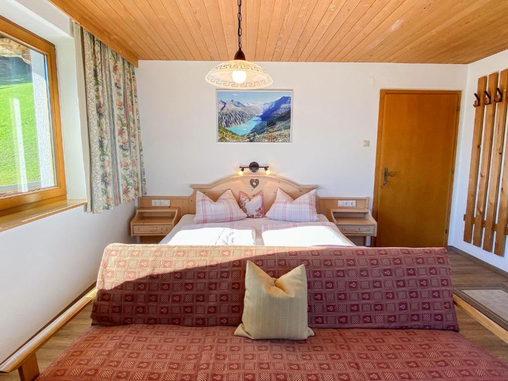 A bed or beds in a room at Apartment Baumannerhof-1 by Interhome