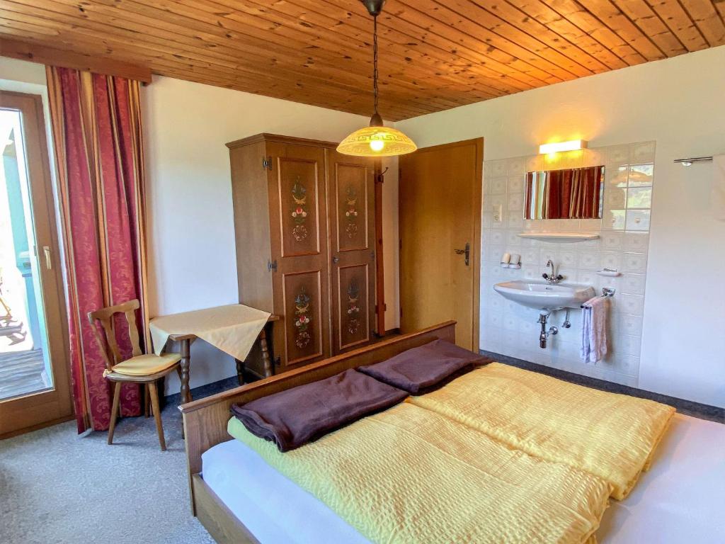 A bed or beds in a room at Apartment Baumannerhof-1 by Interhome