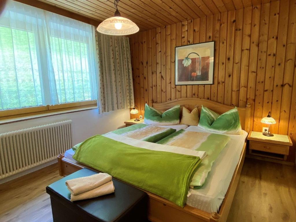 A bed or beds in a room at Apartment Baumannerhof-1 by Interhome