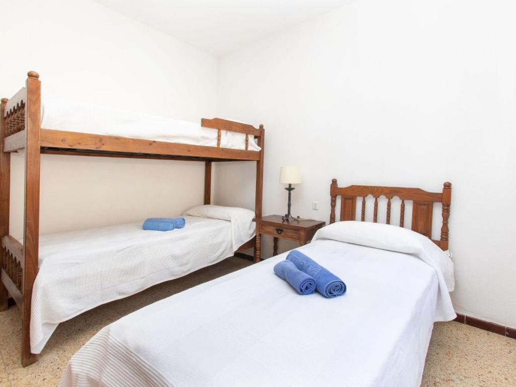 A bed or beds in a room at Apartment S'Esquirols Nº1 by Interhome
