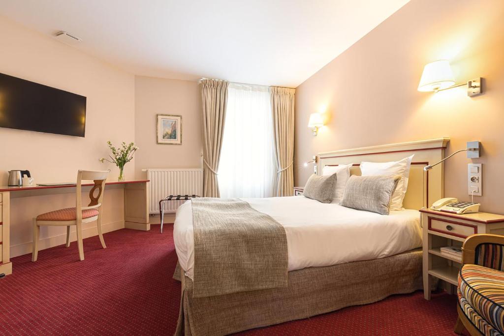 Postel nebo postele na pokoji v ubytování Hôtel Spa Thermalia