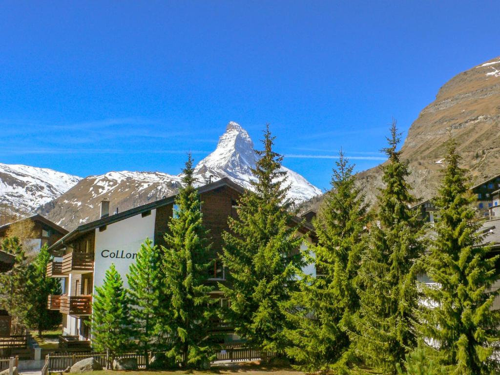 a ski lodge with a mountain in the background at Apartment Select by Interhome in Zermatt