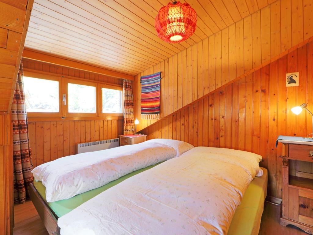 Postel nebo postele na pokoji v ubytování Apartment Lauberhaus by Interhome