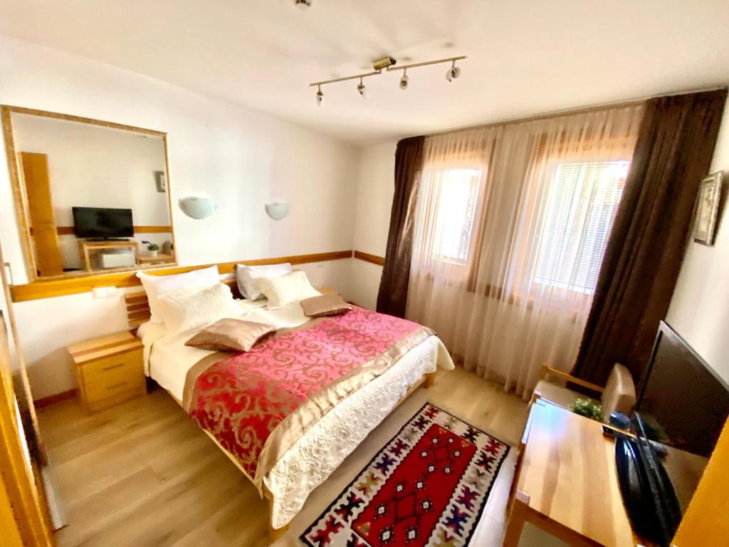 Postel nebo postele na pokoji v ubytování Hotel Berr