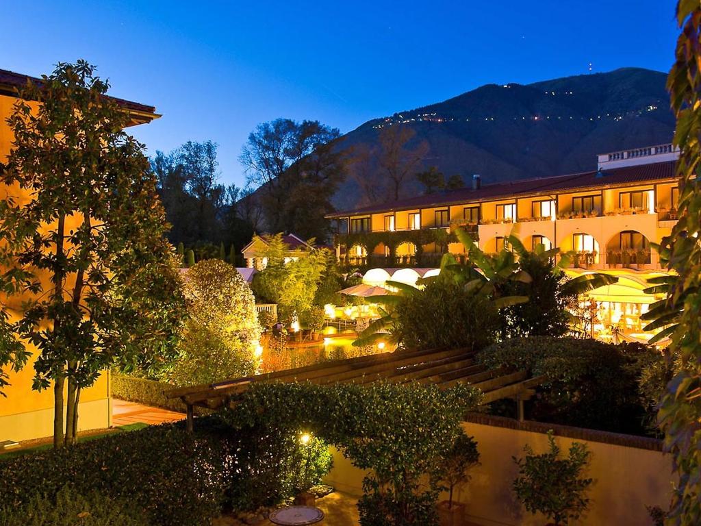 a view of a hotel at night at Apartment Residenza Giardino by Interhome in Ascona