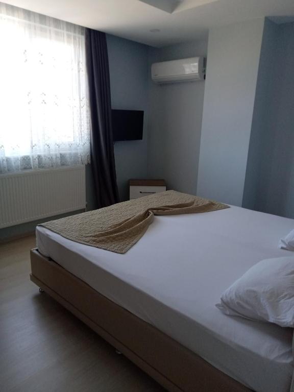 Postel nebo postele na pokoji v ubytování Hannapart Otel
