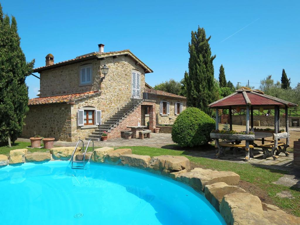 a large pool in front of a house at Holiday Home Casa Clotilde by Interhome in Civitella in Val di Chiana