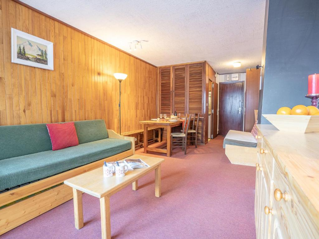 a living room with a couch and a table at Apartment Le Grand Tichot A et B - Val Claret-3 by Interhome in Tignes