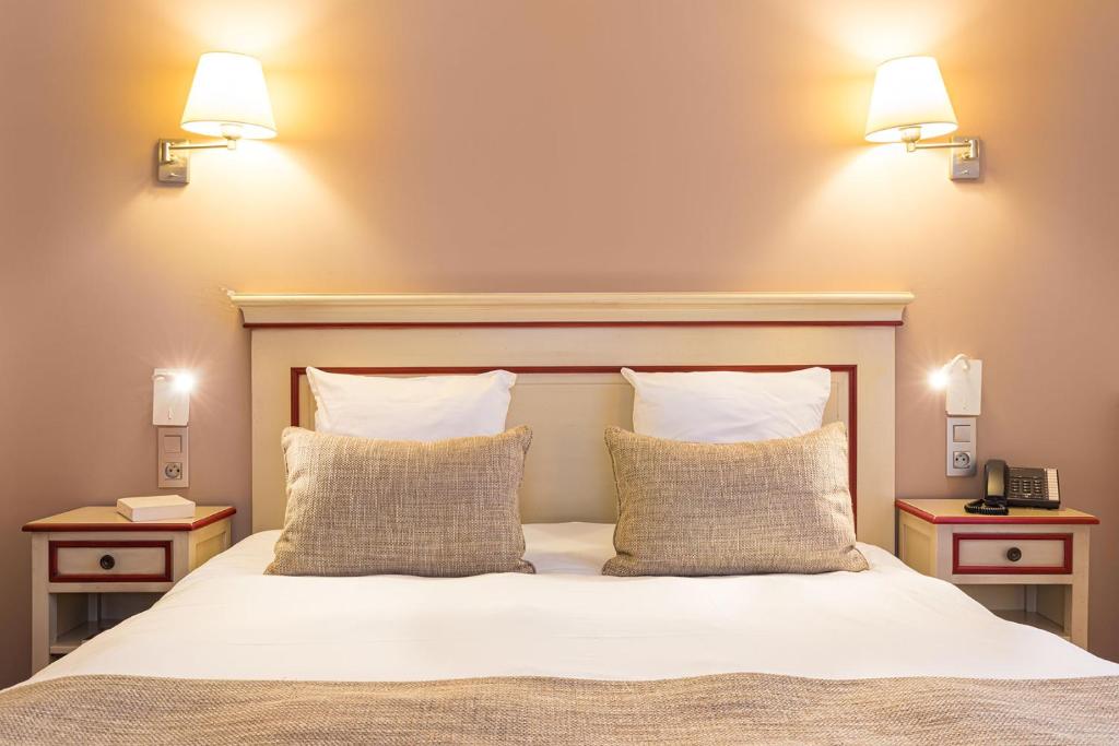 Postel nebo postele na pokoji v ubytování Hôtel Spa Thermalia