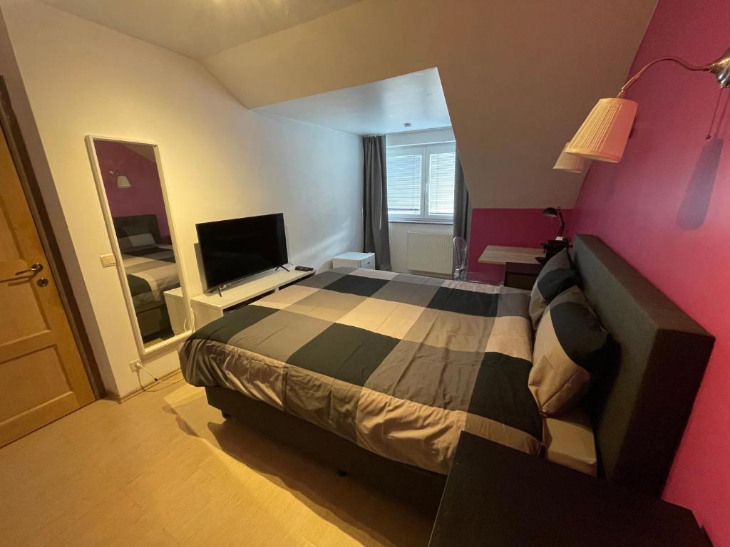 Postel nebo postele na pokoji v ubytování B&B groot-bijgaarden center
