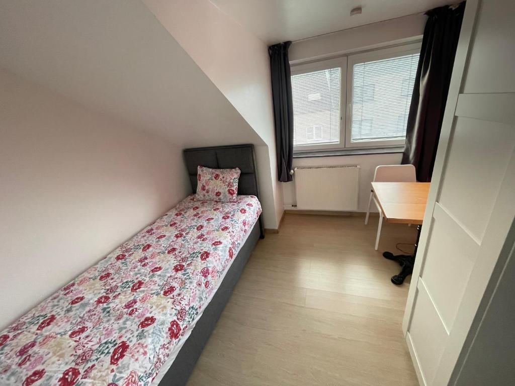 Postel nebo postele na pokoji v ubytování B&B groot-bijgaarden center