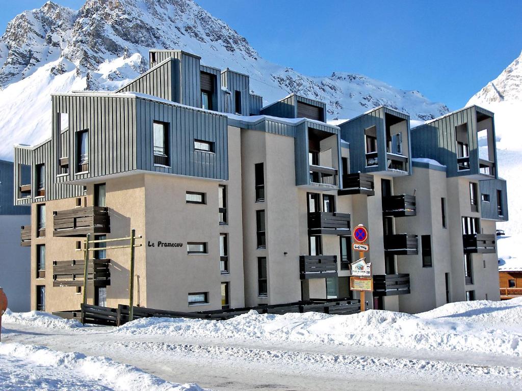 a building in the snow in front of a mountain at Apartment Le Pramecou - Val Claret-8 by Interhome in Tignes